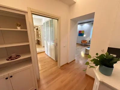 a living room with a hallway with a door to a room at Angolo al Vignola in Rome