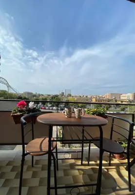 a table and chairs on a balcony with a view at Al posto di Luca in Rome