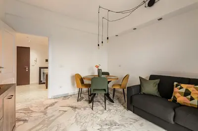 a living room with a table and a couch at Al posto di Luca in Rome