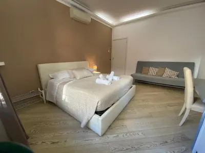 a bedroom with a bed with towels on it at The house of St. Peter in Rome
