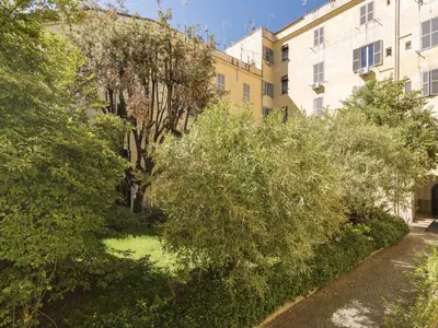 a garden in front of a building at Apartment Marsicum by Interhome in Rome