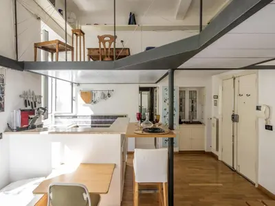 a kitchen and dining room with a table and chairs at Apartment Marsicum by Interhome in Rome