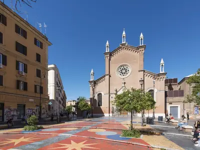 a large church with a clock on the front of it at Apartment Marsicum by Interhome in Rome