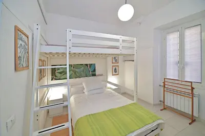 a bedroom with a bunk bed in a room at Lucia Casa Vacanze Ponte Milvio in Rome