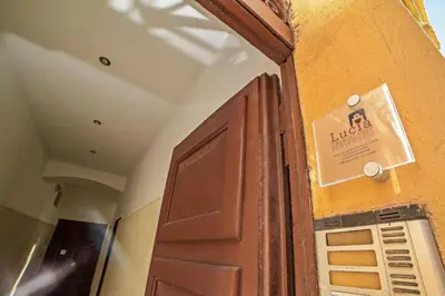 a door in a room with a sign on the wall at Lucia Casa Vacanze Ponte Milvio in Rome