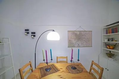 a dining room with a table with candles on it at Lucia Casa Vacanze Ponte Milvio in Rome