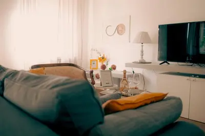 a living room with a couch and a table at RHOME - Luxury Sharing Home in Rome