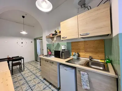 a kitchen with a sink and a counter top at VerdePigna Apartment in Rome