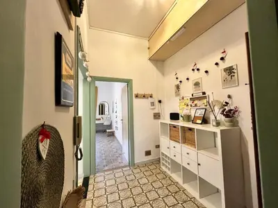 a hallway with a door leading to a room at VerdePigna Apartment in Rome