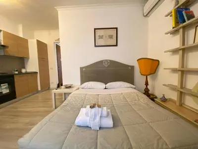 a bedroom with a bed with white towels on it at Terracehome71 - Apartment with relaxing terrace near Vatican in Rome