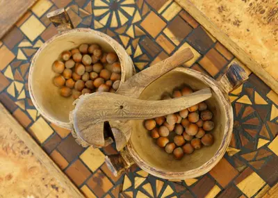 two bowls of hazelnuts sitting on a tile floor at Villa Mara Appia antica in Rome