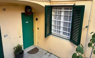 a green door and a window on a house at Monteverde Nest in Rome