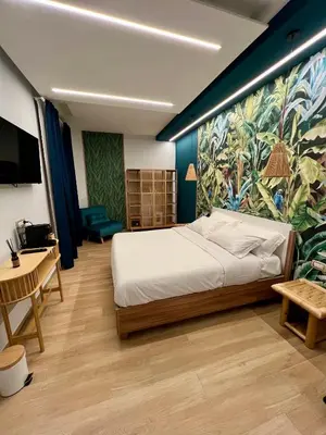 an entrance to a building with two wooden doors at Eterna Suites Roma in Rome