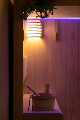 a bath tub in a bathroom with a light at ROMAC Baullari II 4bdr near Campo de Fiori in Rome