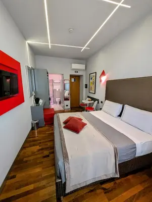 a bedroom with a large bed in a room at Affittacamere RFI in Rome