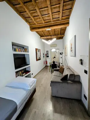 a living room with a bed and a couch at Domus Forus in Rome