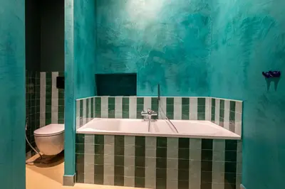 a bathroom with a tub and a toilet at ROMAC Baullari III - Family apartment in Campo de Fiori in Rome