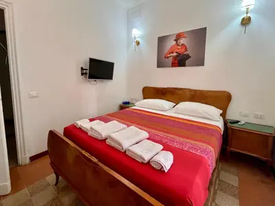 a bedroom with a bed with towels on it at Atelier Montecuccoli in Rome