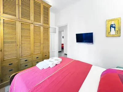 a bedroom with a large bed with two towels at Atelier Montecuccoli in Rome