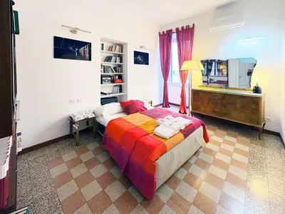 a bedroom with a bed and a television in it at Atelier Montecuccoli in Rome