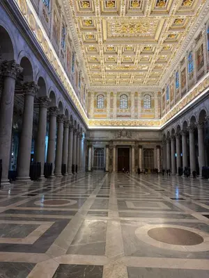 a large room with columns and a ceiling at B&B ErinaHouse in Rome