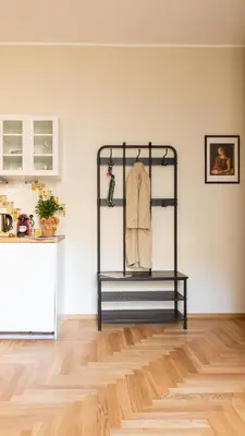 a room with a shelf with a shirt on it at Porta Pia apartment ZENO 53 in Rome