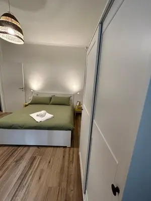 a small bedroom with a bed and a closet at Appia Little Charme 44 in Rome