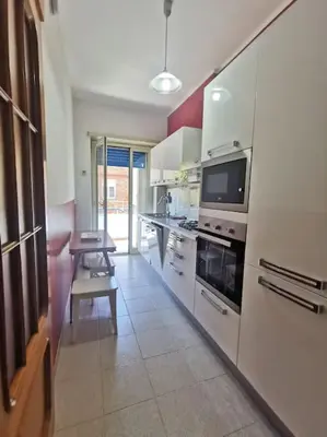 a bedroom with a bed and a tv on the wall at La Regina Tiberina in Rome