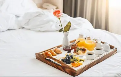 a tray of breakfast foods on a bed at HC - Live Roma Pantheon View in Rome