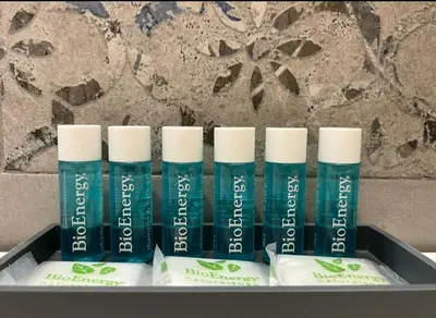 a group of four blue deodorant bottles in a box at HC - Live Roma Pantheon View in Rome