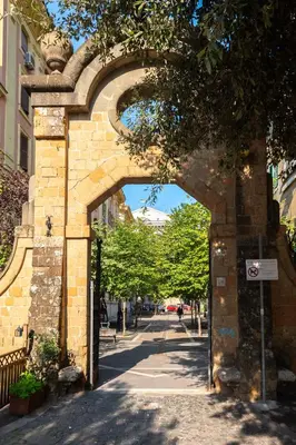 an archway over a street in a city at Maison Doria Vaticano in Rome
