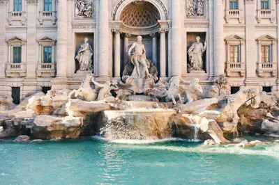 a water fountain in front of a building at Simposio - Luxury Apartment Rome in Rome
