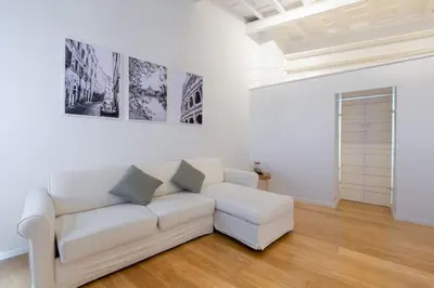 a white living room with a white couch at Appartamento a Piazza di Spagna in Rome