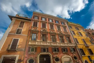 a tall building in front of a blue sky at Appartamento a Piazza di Spagna in Rome