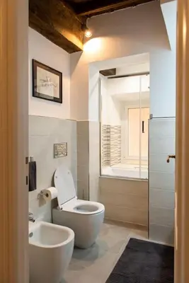a bathroom with a toilet and a sink at Stelletta Apartment in Rome