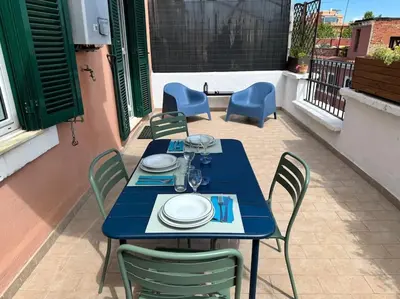 a blue table and chairs on a patio at Blue Sky in Rome