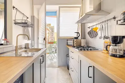a kitchen with a sink and a counter top at Portami in Villa -Gianicolo in Rome