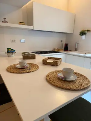 two cups and saucers on a counter in a kitchen at Hestya Domus in Rome
