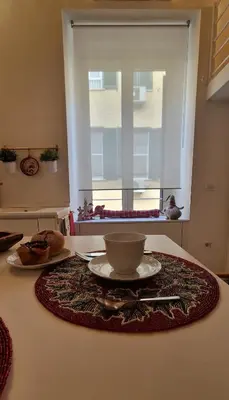 a table with a bowl and a plate on it at Hestya Domus in Rome