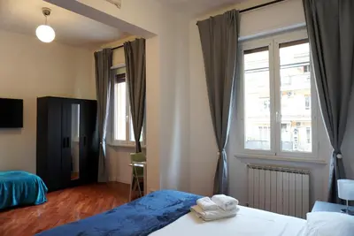 a hotel room with a bed and a window at Holidays Palumbo in Rome