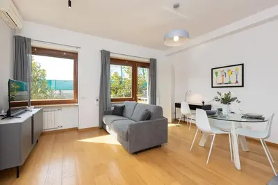 a living room with a couch and a table at Dona's House in Rome