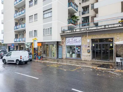 a white van parked in front of a building at The Best Rent - Modern one-bedroom apartment in the Cipro area in Rome