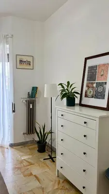 a balcony with a table and a view of a city at Sunny Apartment with Stunning San Pietro View in Rome