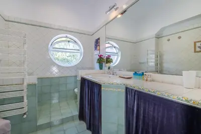 a bathroom with a sink and a shower at Vatican Museum apartment by Varental in Rome