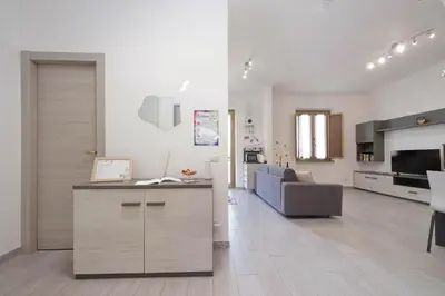 a large living room with a kitchen and a living room at Da zia Maria in Rome