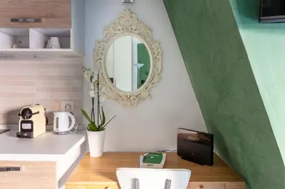 a kitchen with a sink and a mirror on the wall at Vaticano 44 by Hili in Rome