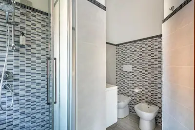 a bathroom with a toilet and a sink at Vaticano 44 by Hili in Rome