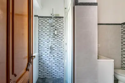 a bathroom with a shower with a toilet and a sink at Vaticano 44 by Hili in Rome