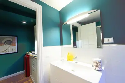 a bathroom with a sink and a mirror at Casa di Paolo a Fontana di Trevi in Rome
