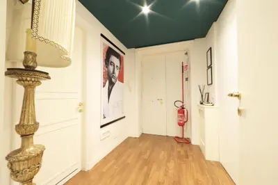 a hallway with a green ceiling and a red fire hydrant at Casa di Paolo a Fontana di Trevi in Rome